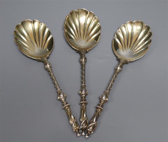A set of three late Victorian silver fancy serving spoons with figural terminals, Goldsmiths & Silversmiths Co Ltd, London, 1899